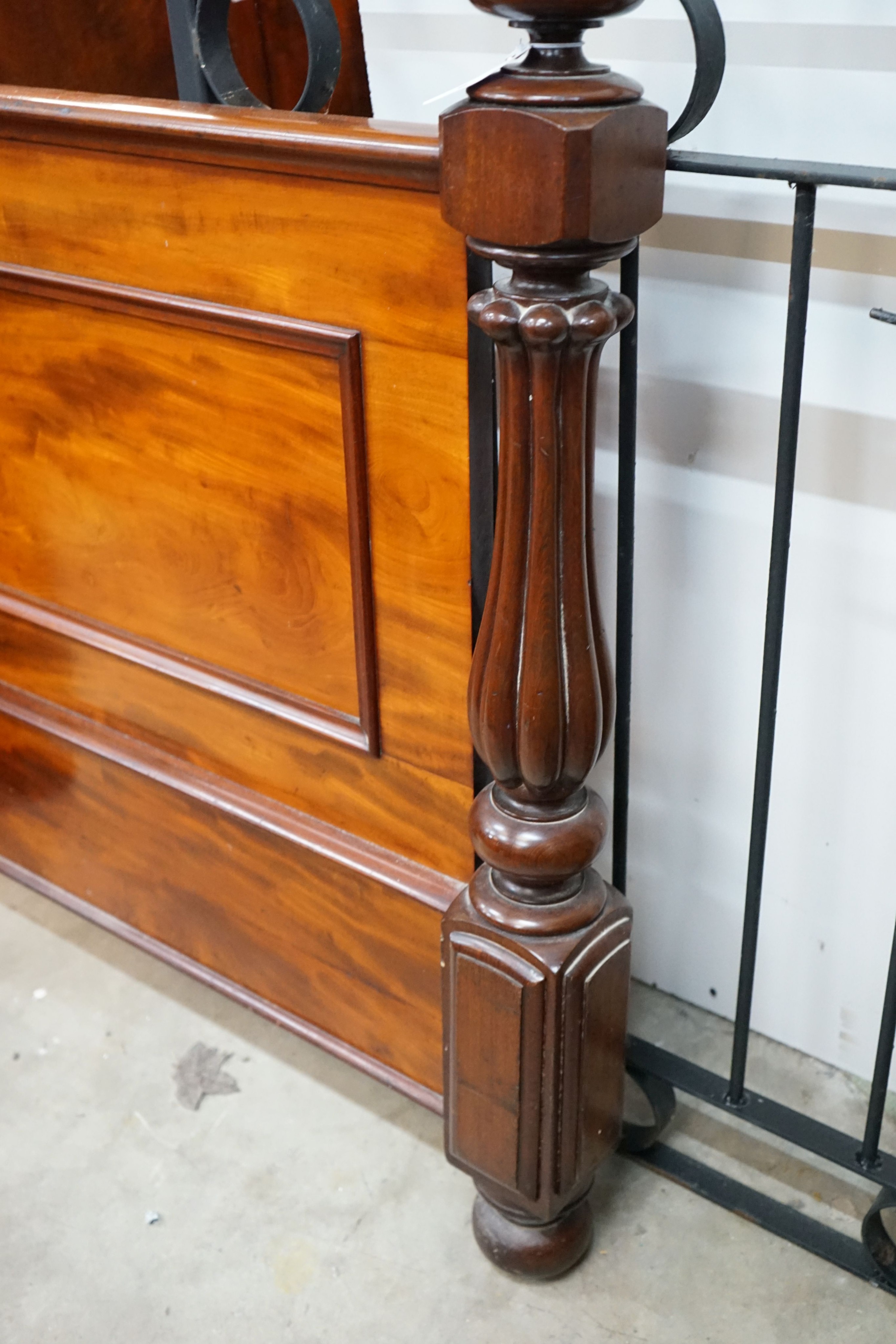 A Victorian mahogany footboard, width 154cm, height 106cm